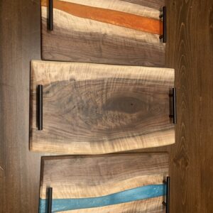 Handmade black walnut and epoxy charcuterie board.